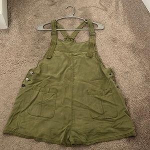Super cute Oliver green Romper. Lightly worn with adjustable straps